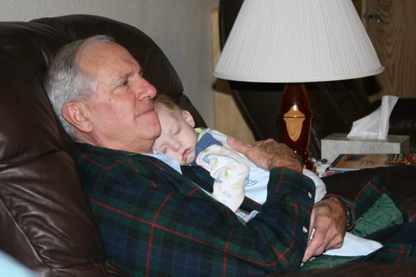Asleep in Grandpa's Arms